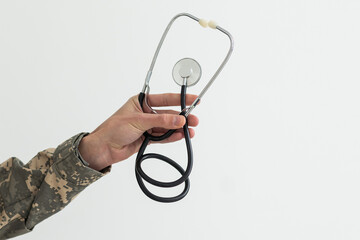 Young man army soldier holding stethoscope.
