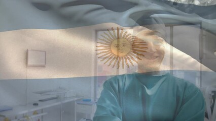 Sticker - Animation of flag of argentina over biracial surgeon standing arms crossed in operation theater