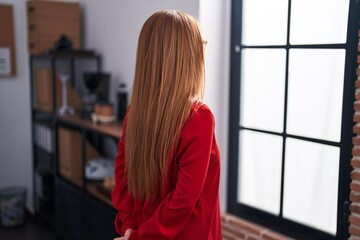 Poster - Young redhead woman business worker looking throw the window at office