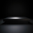 low wide black pedestal with a flat surface on a black background, volumetric lighting