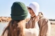 © Krakenimages.com - Mand and woman couple smiling confident put cap on head at seaside
