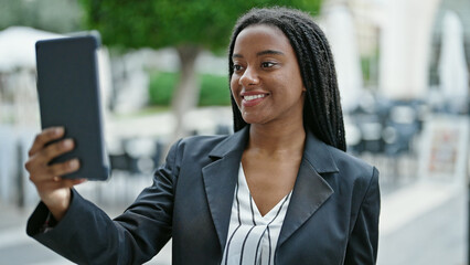 Sticker - African american woman business worker having video call at coffee shop terrace