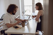 © Kostiantyn - Married couple freelancers sit at table in living room with laptops and working from home office