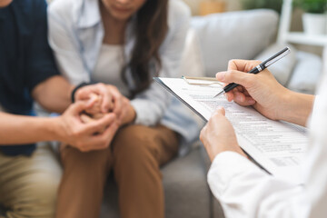 Wall Mural - Psychology, depression asian young couple, patient consulting problem mental health with psychologist, psychiatrist at clinic together, husband encouraging by holding hand of wife, therapy health care