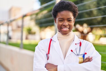 Sticker - African american woman wearing doctor uniform standing with arms crossed gesture at street