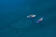 Active fun, Woman and man floats on river on supboard, sun light. Concept summer lifestyle sport for fun, aeial top view
