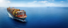 Panoramic Front View Of A Large Cargo Ship Carrying Containers For Import And Export, Business Logistic And Transportation In Open Sea With Copy Space 