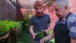 © Marco - Senior Gardener Assisting Customer at Plant Store, Horticulture in Flower Shop Backyard