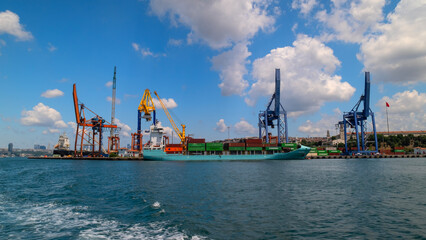 Ships unload their cargo at the port of 