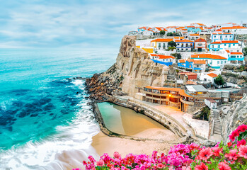 Azinheiras do Mar landscape, beach and fishing village with colorful houses of fishermen in Azenhas do Mar, Colares, Sintra, Portugal.