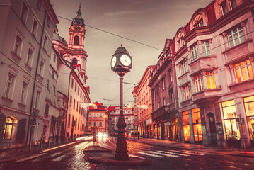 Wall Mural - Czech Republic Prague square with old street lamp with clock dark evening sky retro vintage roofs