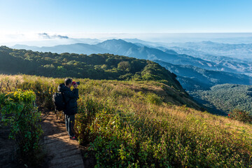 Sticker - Man with camera shoot viwe at  kew mae parn viewpoint.Doi Inthanon Chiang Mai in Thailand