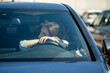 © DimaBerlin - Exhausted female sit on driver seat of car not driving look through windshield thinking. Frustrated woman suffering money crisis, troubles at work or relationship breakup pondering inside auto vehicle