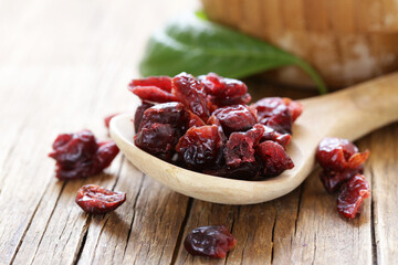 Wall Mural - Dried berries red cranberries on a wooden table