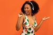 © Prostock-studio - Joyful pretty black woman in swimwear using wireless headphones, dancing