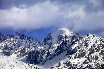 Poster - Snow mountaims in clouds at sunny winter day. Caucasus Mountains. Svaneti region of Georgia.