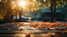 Empty Wooden Table Top With Autumn Leaves, Blurry Background, Product Presentation Concept
