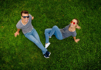 Canvas Print - Top view of a happy young couple in the park together