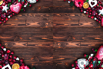 Sticker - Valentine's Day Background with love themed elements like cotton and paper hearts, flowers, berries, oranges and other decorations. Wooden old parquet on the back.