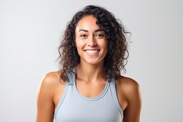 Poster - Portrait of a beautiful young woman smiling and looking at camera isolated on a white background