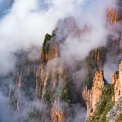 Sticker - Clouds above the colorful peaks of Huangshan National park. China.