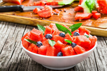 Wall Mural - watermelon with blueberries and fresh mint , selective focus