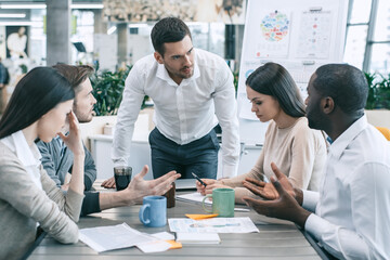 Group of young people having business meeting work together