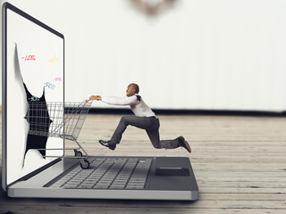 Poster - Businessman pushes a Shopping cart on the keyboard of laptop