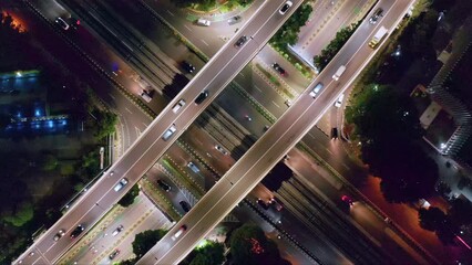 Wall Mural - Top View Of Motorways At Nighttime At Kuningan City In Jakarta, Indonesia. Aerial Shot