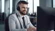 © Aliaksandra - Handsome male call center worker in headphones in the office works at a computer. The concept of customer service. AI generated