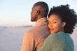 © wavebreak3 - Portrait of happy african american couple embracing and smiling on sunny beach