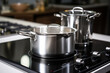 Photo metal pot on induction hob in modern kitchen. modern kitchen pot cooking induction electrical stove hob concept