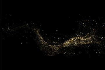 Scattered golden particles on a dark background.Festive background or design element.