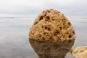 Canvas Print - Closeup shot of a giant rock in a water