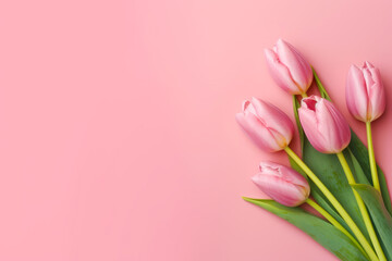 Wall Mural - Bouquet of pink tulips on pink background with green leaves. Generative AI.