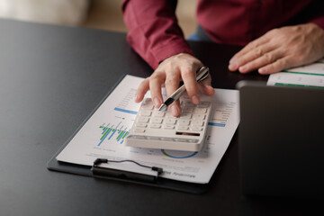 Poster - Business man pointing to a pie chart document showing company financial information, He sits in her private office, a document showing company financial information in chart form. Financial concepts.