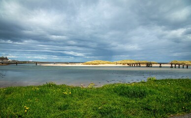 Poster - Picturesque coastal landscape featuring two bridges: the new bridge, and the old bridge