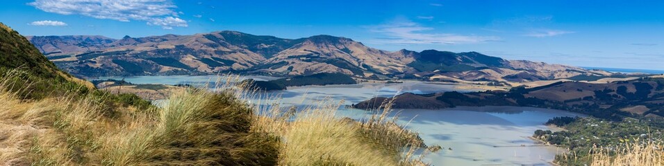 Poster - Outdoor landscape, showing rolling hills with sandy and grassy terrain with a lake