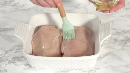 Sticker - Time lapse. Step by step. Seasoning chicken with salt and pepper for baking in a baking dish.