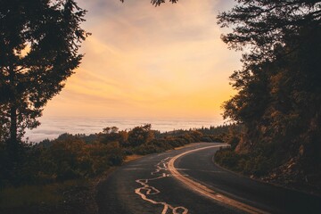 Sticker - the road sign is painted on the side of a hill