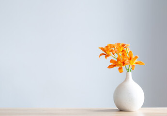 Poster - summer flowers in white modern vase on wooden shelf