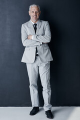 Aufkleber - Studio portrait of mature man in suit, arms crossed and smile on dark background. Confidence, pride and professional career for happy executive businessman or senior business owner or successful ceo.