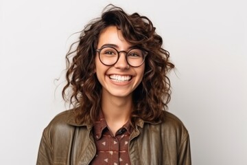 Wall Mural - Portrait of a happy young woman in eyeglasses looking at camera