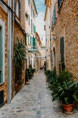  Narrow street in historic village in Spain.