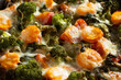 Gratin with broccoli, carrots and cheese baked in the oven on a dark wooden table, close up