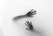 Defocused Hand Silhouette Behind Frosted Glass In Black And White Mode, Halloween Concept