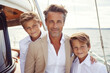 Close up portrait of elegant father with sons sailing. Generative AI