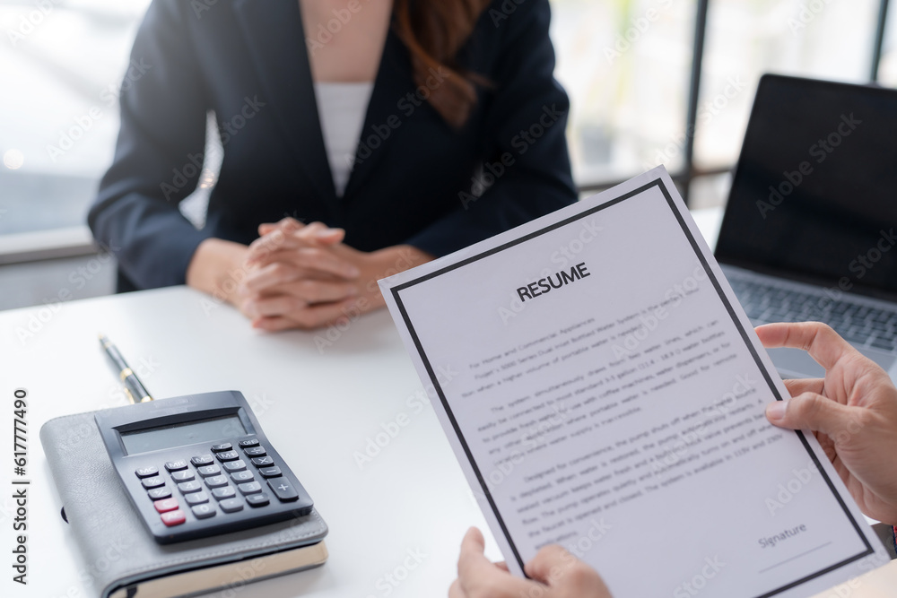 Professional Woman Ready for Job Interview. Businesswoman Applying with Resume for Recruitment and Hiring. Successful Job Interview. Confident Female Applicant Presenting Resume to Employer.