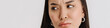 © Drobot Dean - Asian puzzled woman wearing t-shirt frowning and looking aside