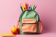 canvas print picture - Bunter Schulrucksack mit Buntstiften, Apfel und Notizbuch vor pinkem Hintergrund, Schulstart, Generative AI